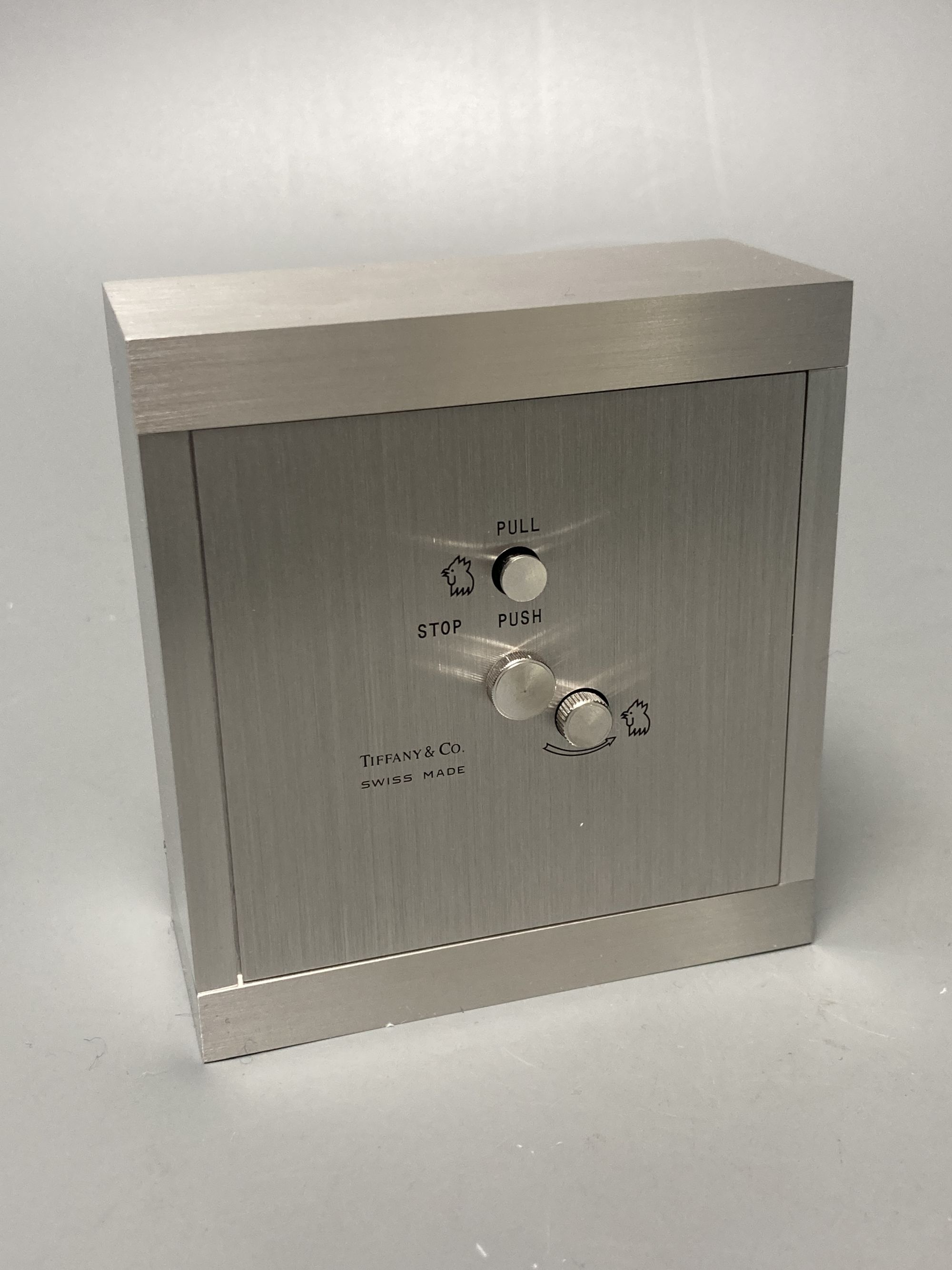A boxed Tiffany alarm clock, 9 x 8cm